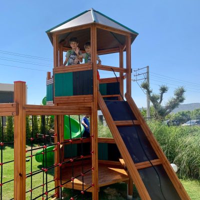 Wooden playhouse with a climbing ramp — Elysee