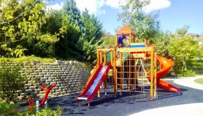 Wooden playground with red slides — Elysee