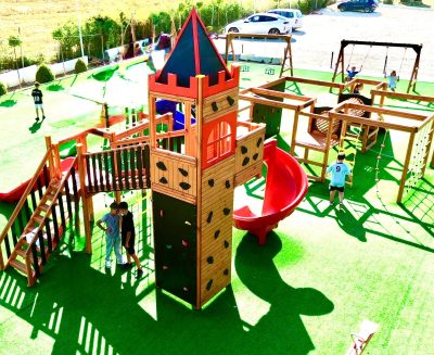 Castle-themed wooden playground — Elysee