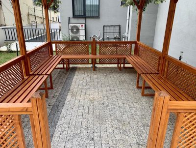 Seating inside a wooden gazebo — Elysee