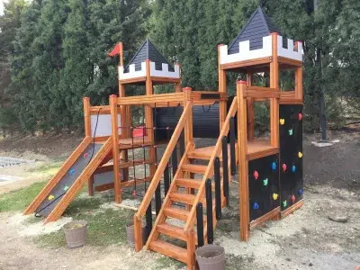 Castle-themed wooden playground — Elysee