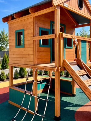 Wooden playhouse with a climbing ramp — Elysee