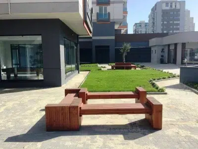 Wooden seating around a tree — Elysee