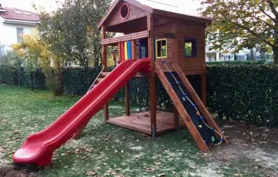 Wooden playhouse with slide — Elysee