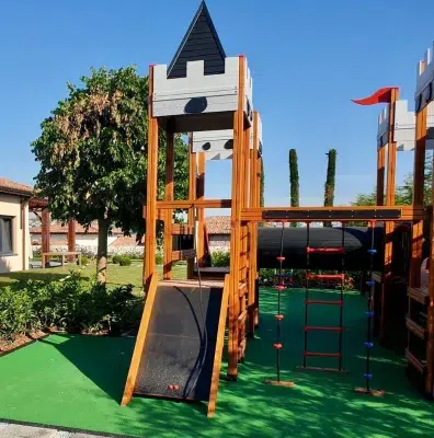 Castle-themed wooden playground — Elysee