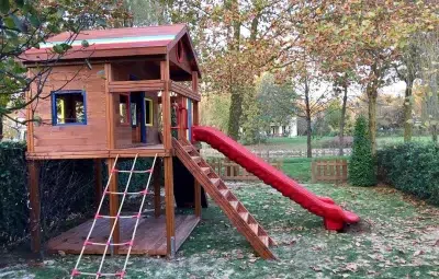 Wooden playhouse with slide — Elysee