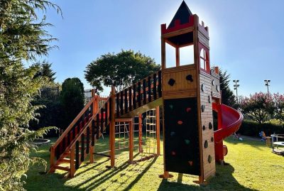 Castle-themed wooden playground — Elysee
