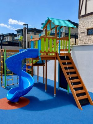 Wooden playground with blue slides — Elysee