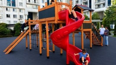 Wooden playground with red slides — Elysee