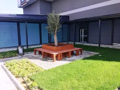 Wooden seating around a tree — Elysee
