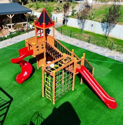 Castle-themed wooden playground — Elysee